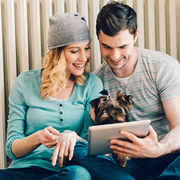 A happy couple with a pet