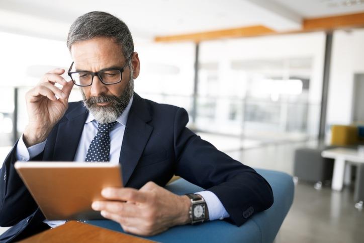 A man watching ipad