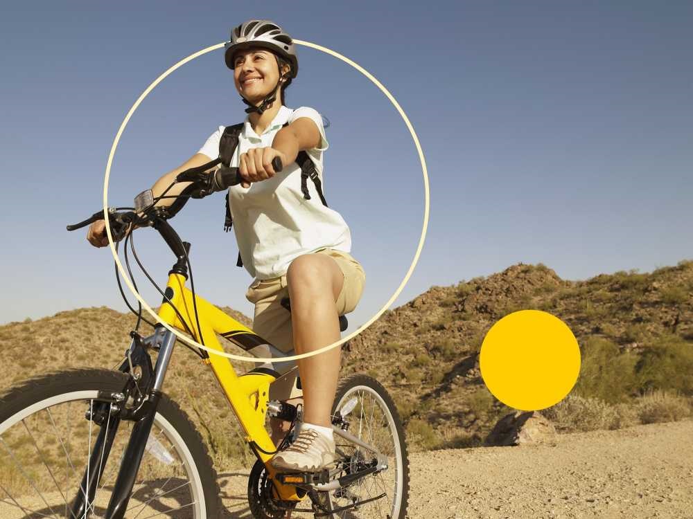 Lady on bike being healthy