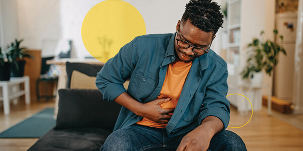 Person holding hands near stomach