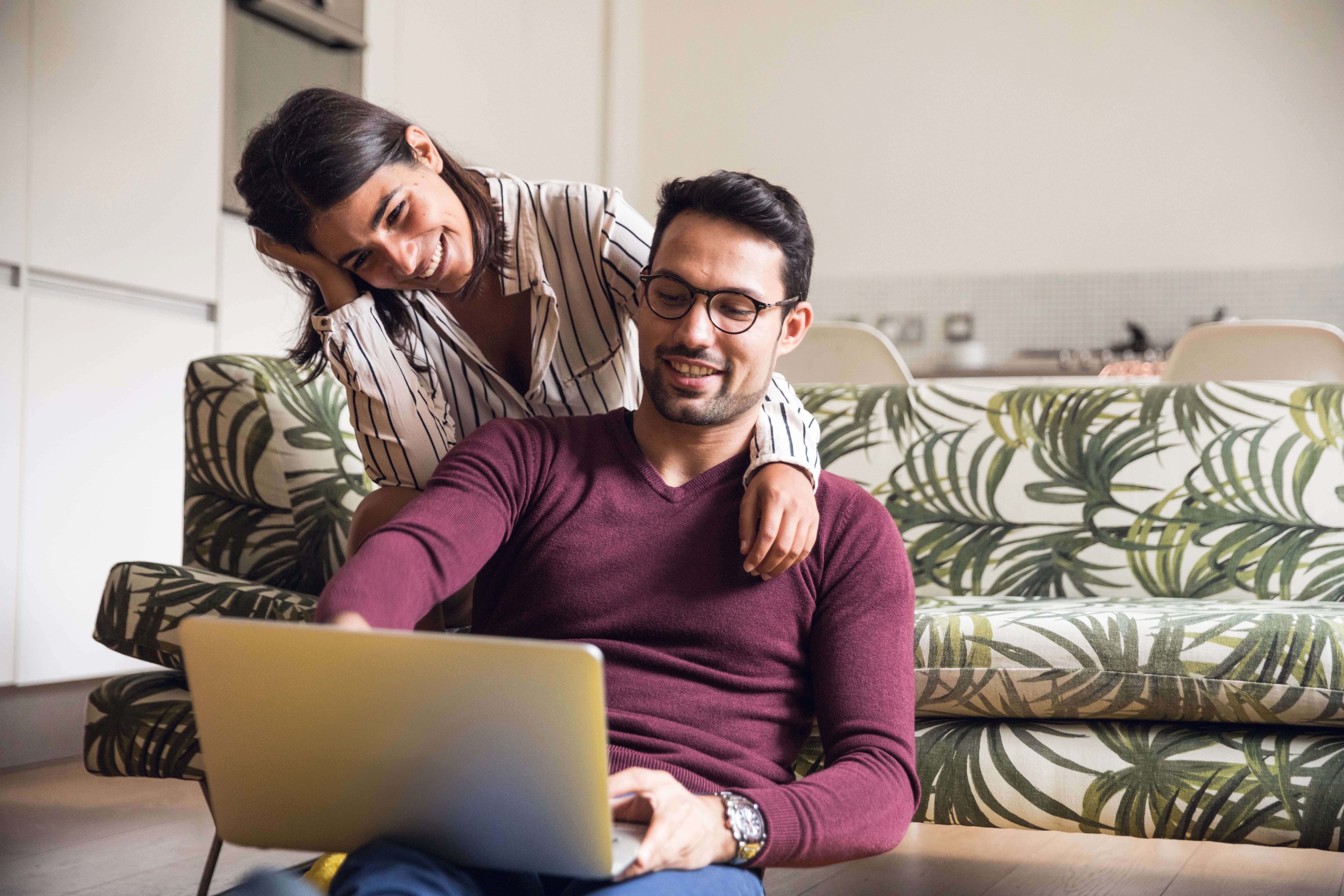 Couple using laptop