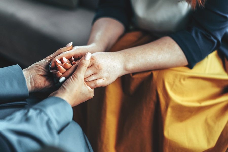 two people holding hands