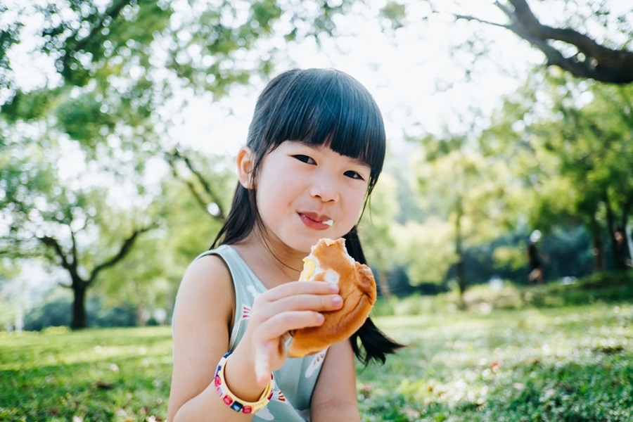A girl eating a sandwich