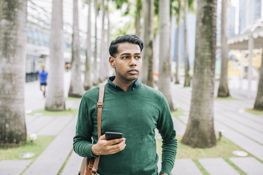 man walking down road