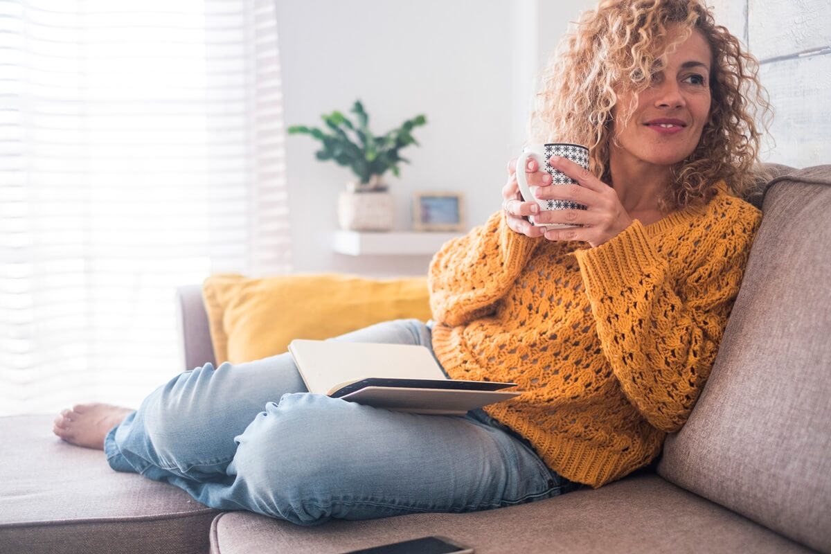 Lady drinking a hot drink