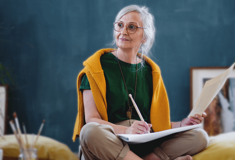 Lady in yellow scarf making notes