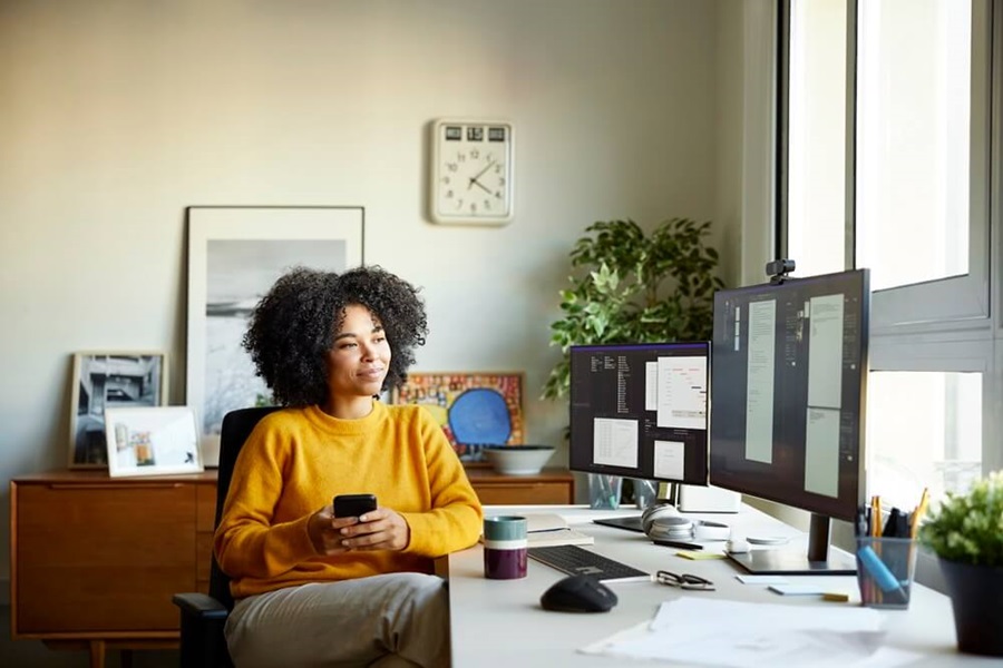 Lady sitting in front of her desk